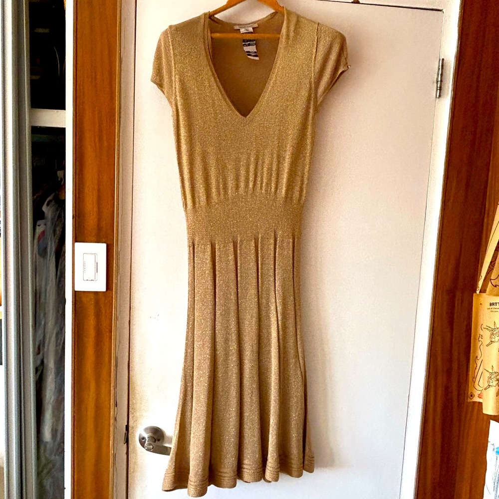 Gold sparkly sweater dress with its own golden slip for underneath.